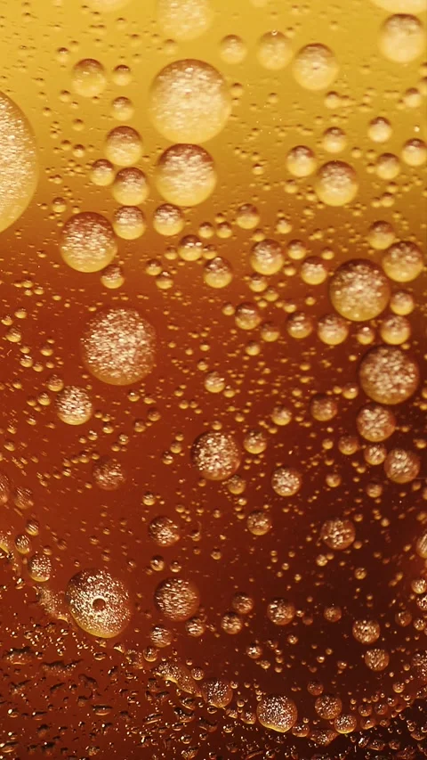 Vertical abstract oil splash on orange liquid water surface background Stock Footage 341825069
