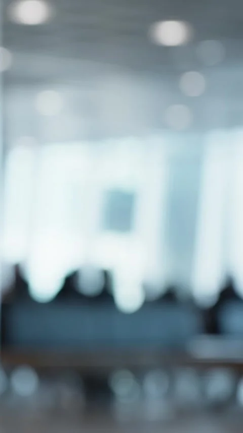 Vertical abstract shot of an out-of-focus man running indoors, creating a Stock Footage 334736187