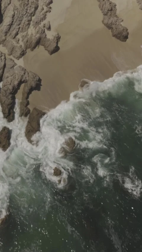 Vertical Accent Over Waves &amp; Rocks Stock Footage 285566094