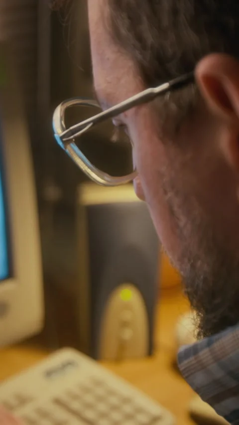 Vertical of Accountant Working on Payroll Spreadsheet on Retro Computer Stock Footage 327241422