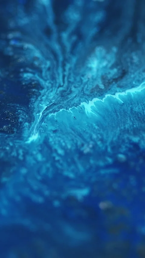 Vertical acrylic paint splash sparkling fluid blue Stock Footage 295531350