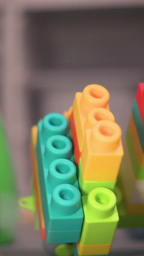 Vertical Action Child Hand Pushing Over Colorful Block Tower In Playroom Stock-Footage 330970830