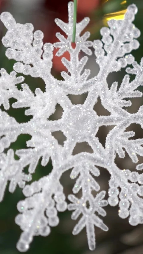 Vertical Adorned holiday snowflake, festive Christmas snow flake hang on tree Stock Footage 315237337