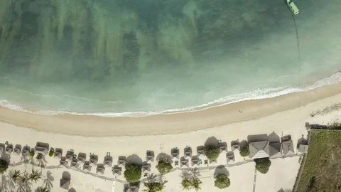 Vertical aerial beach view with huts and beautiful sea floor in Indonesia Stock Footage 115266829