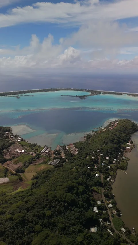 Vertical Aerial Bora Bora Lagoon Reef Village Sand Bank French Polynesia Stock-Footage 335508640