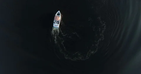 Vertical aerial down top view. Flight away from the boat. Video stock 94927981