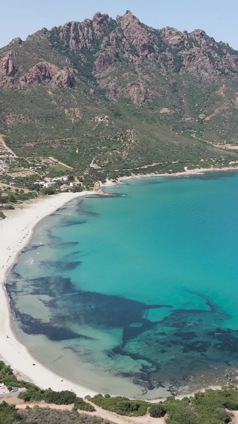 Vertical aerial drone footage of the crystal water and the beach Stock Footage 205521253
