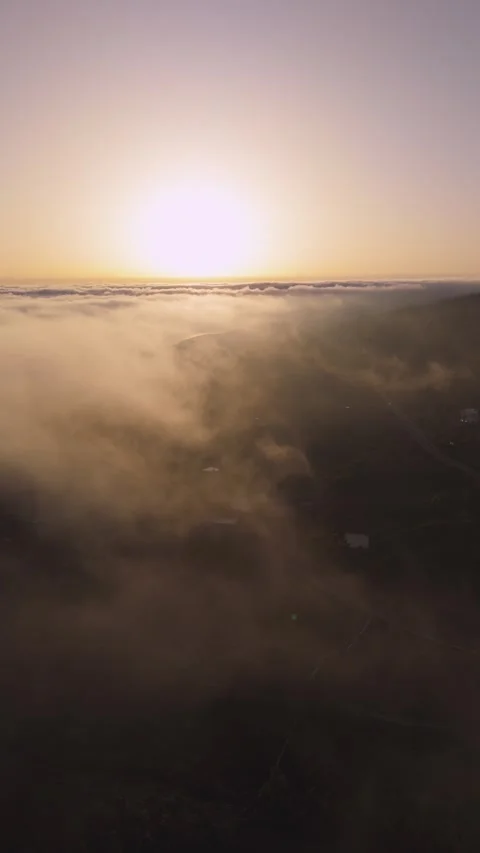 Vertical Aerial Drone Over Clouds at Sunset – Sun on Horizon – 4K Nature Stock-Footage 314600617