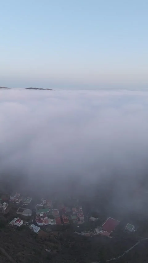 Vertical Aerial Drone Over Clouds at Sunset – Sun on Horizon – 4K Nature Stock Footage 314600635