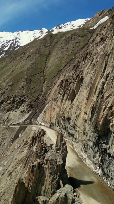 Vertical Aerial drone shot capturing the scale and danger of Zojila’s cliffs. Stock Footage 310807244