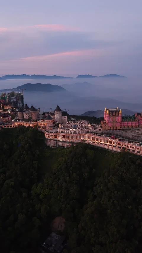 Vertical Aerial Drone Shot of Mountain Village at Sunset Stock Footage 336383302