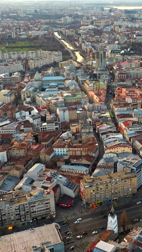 Vertical aerial drone view of Bucharest city at sunset. Moving traffic. Romania Stock Footage 269129091