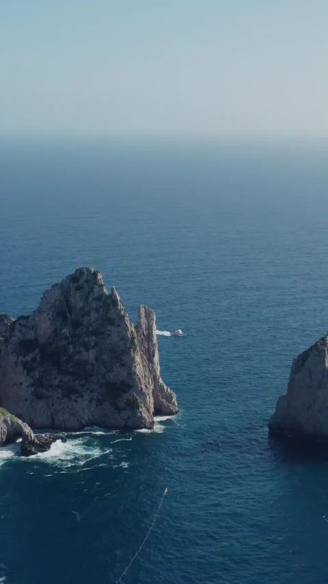 Vertical Aerial Drone View of Capri Cliffs (Faraglioni di Mezzo) by the Stock Footage 330854621