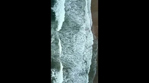 Vertical Aerial Drone View of Ocean Waves Breaking on Sandy Beach Stock Footage 330271065