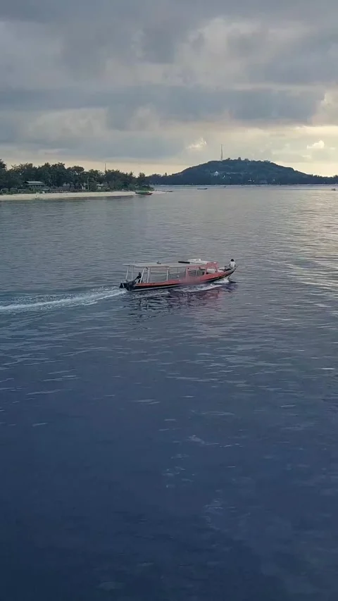 Vertical of Aerial drone view. Speed boat yacht for tourism goes in ocean Stock Footage 278485605