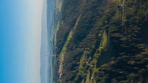Vertical aerial flight over amazing hilly landscape lit with morning sunlight Stock Footage 166757183