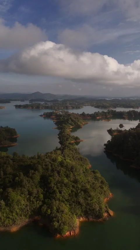 Vertical Aerial Flight Over Narrow Island in Guatapé Reservoir, Colombia Stock Footage 346398377