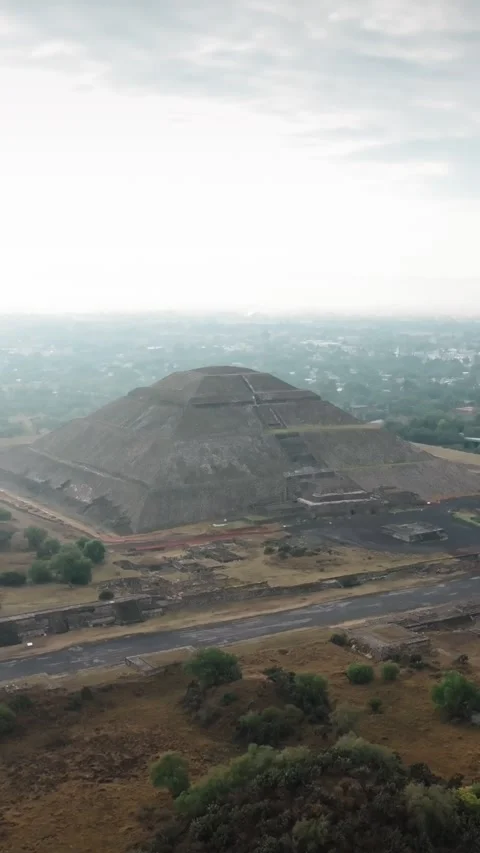 Vertical aerial flyover overlooking Pyramid of the Sun at dawn in ancient Stock Footage 340579373