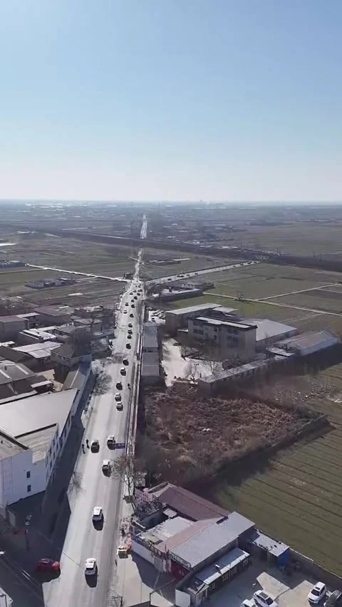 Vertical Aerial Forward Flight over Traffic in a Chinese Rural Town Stock Footage 330145369