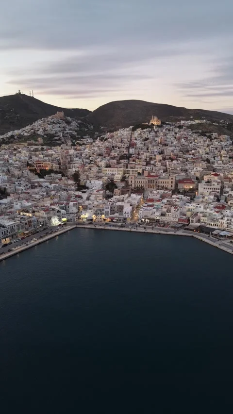 Vertical Aerial Forward Over Syros Ermoupoli Port and City Hall Stock Footage 334802392