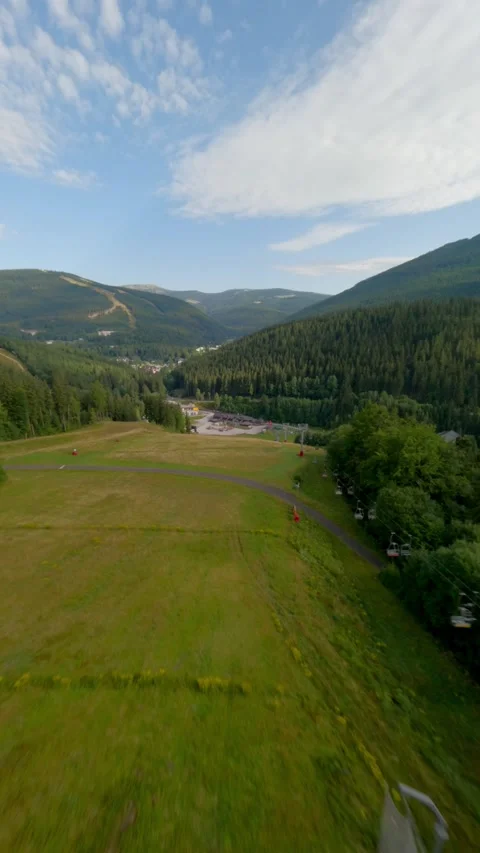 Vertical Aerial FPV Drone Flight Over Czech Mountain Ski Resort In Summer Stock Footage 345262737