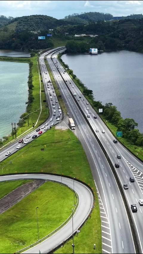 Vertical Aerial Highway Crossing Between Two Reservoirs Video stock 336133778