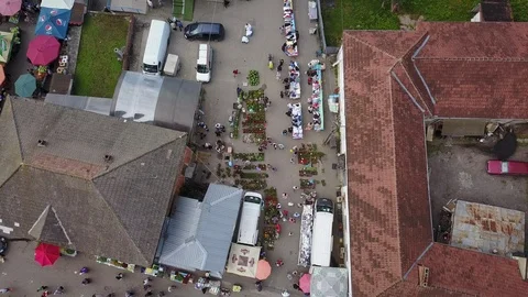 Vertical Aerial Move Forward Over Flower and Clothing Street Market Stock Footage 102451051