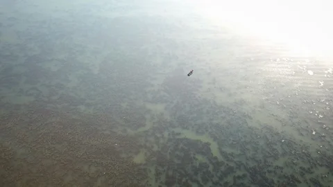 Vertical Aerial Moving Toward Small Isolated Boat In Middle Of Sea Video stock 125170798