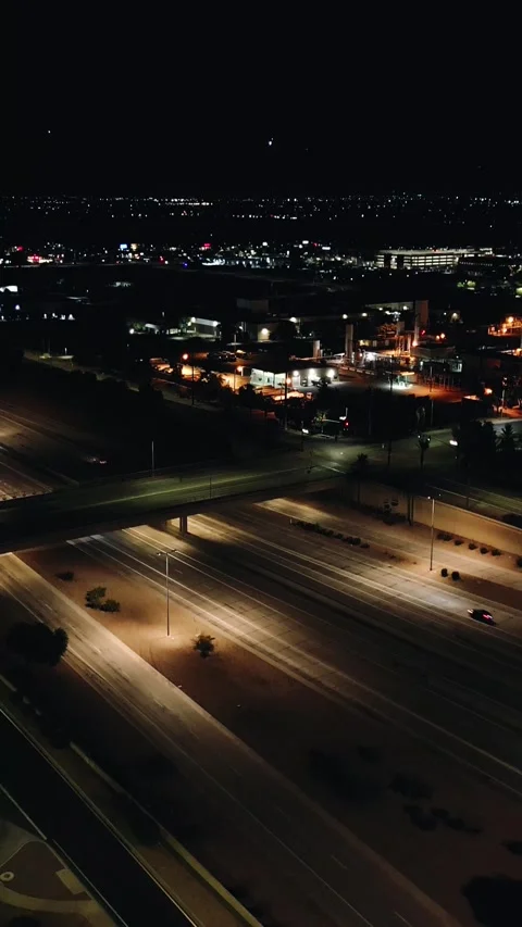 VERTICAL AERIAL NIGHT FREEWAY Stock Footage 248583996