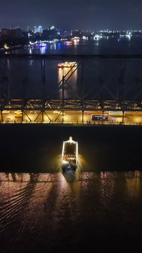 Vertical Aerial Night View of Howrah Bridge and Ferry Kolkata India Stock Footage 330719257
