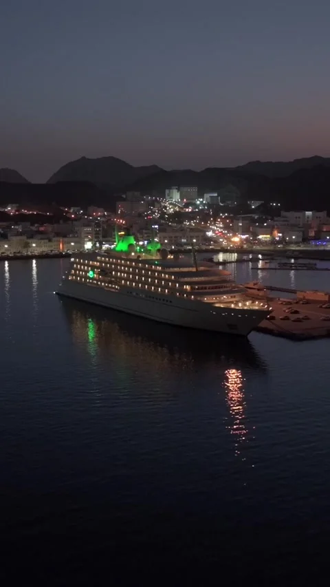 Vertical Aerial Night View of Mutrah Corniche Muscat Oman Waterfront and City Stock Footage 345547337