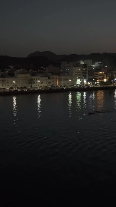 Vertical Aerial Night View of Mutrah Corniche Muscat Oman Waterfront and City Stock Footage 345547338