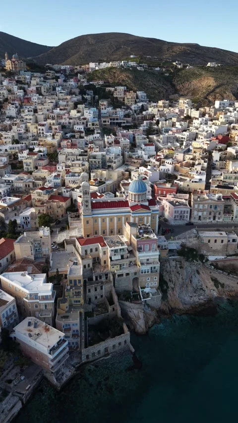 Vertical Aerial Orbit Approaching Agios Nikolaos in Syros Ermoupoli Stock Footage 334555439