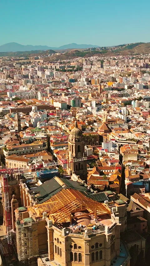 Vertical aerial orbit around Málaga Cathedral, Gothic architecture in historic Stock Footage 334016380