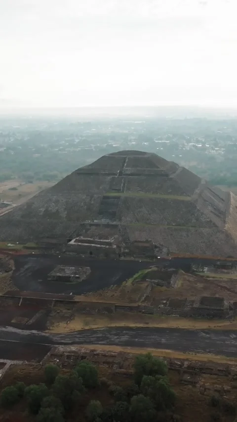 Vertical aerial orbit overlooking Pyramid of the Moon and Plaza of the Moon at Stock Footage 340579326