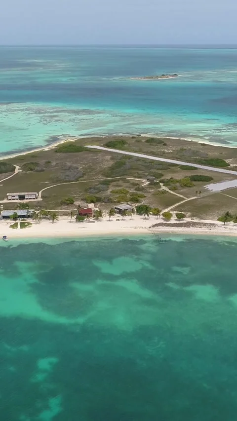 Vertical Aerial pan over Dos Mosquises Carribean Island, in Los Roques Stock Footage 327508931