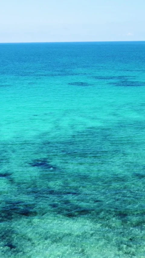 Vertical Aerial pull back view of Lu Impostu beach in Sardinia Stock Footage 340354399