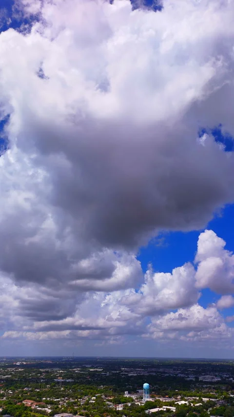 Vertical aerial pull out video rolling storm clouds Video stock 314463090