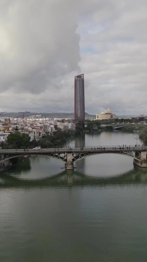 Vertical Aerial Pullback: Guadalquivir River and Torre Sevilla Stock Footage 332626847
