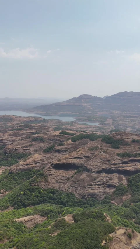 Vertical aerial of Ratangad cliffs and Sahyadri valley India Stockbeeldmateriaal 341127563