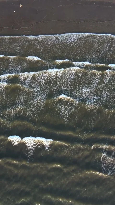 Vertical Aerial Shot of Ocean Waves at Miramar Beach Goa India Stock Footage 335266792
