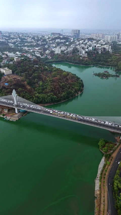 Vertical aerial shot of traffic Jam at Durgam Cheruvu in Hyderabad, India Stock Footage 340477364