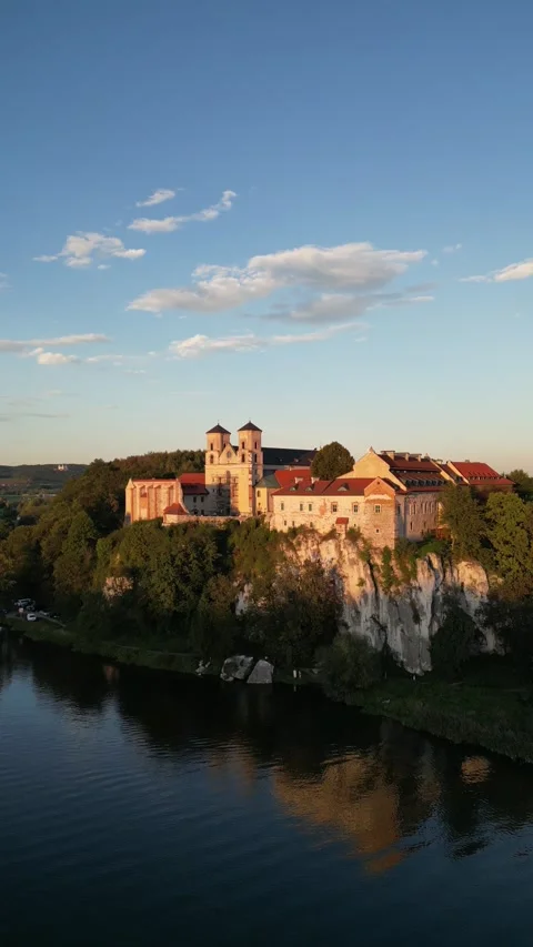 Vertical aerial sunset view of Benedictine Abbey in Tyniec Poland Video stock 335706517