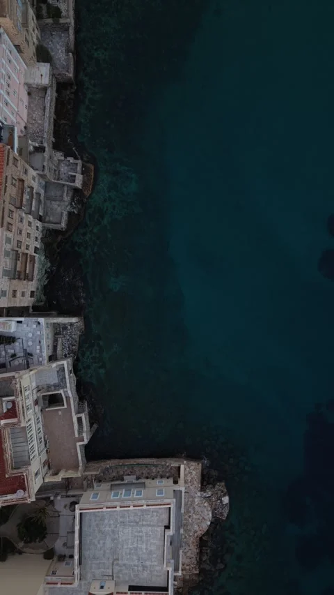 Vertical Aerial Top Down Ascend Over Agios Nikolaos Coast Stock Footage 334802650