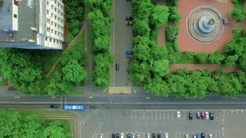 Vertical aerial top down view shot traffic on the roadway in the city in the Stock Footage 76680681