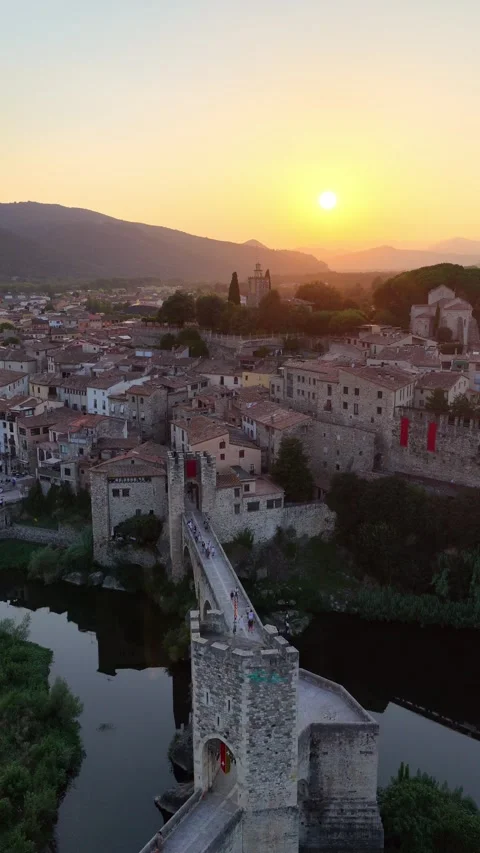 Vertical aerial video of medieval old bridge in Besalu, Girona Provence Stock Footage 320303513
