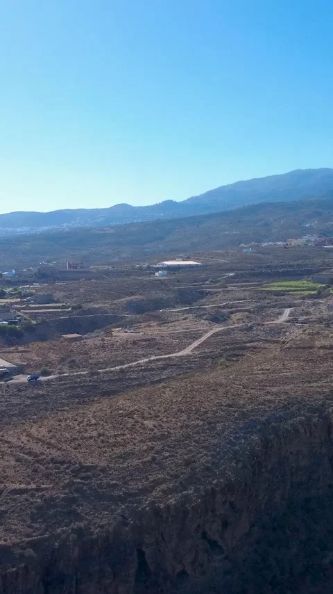 Vertical Aerial View of Arid Volcanic Terrain and Farmland in Tenerife Stock Footage 344851186