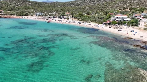 Vertical aerial view of a beach resort and turquoise Aegean coast. Stock Footage 327673565