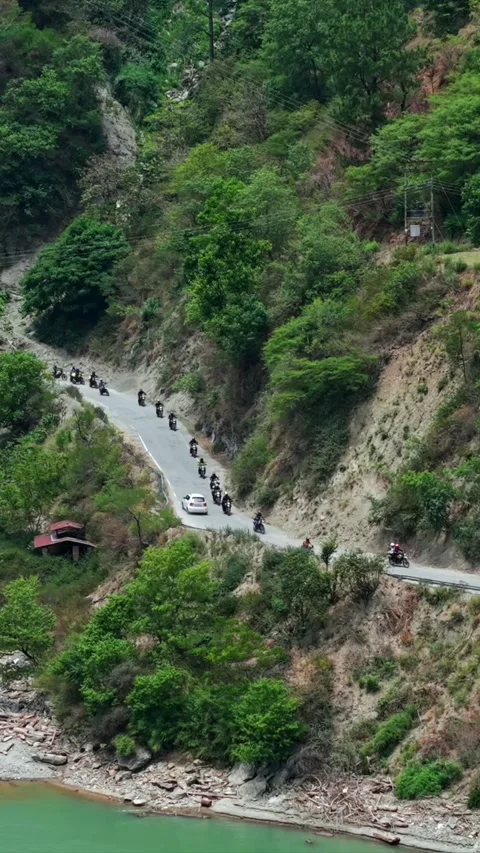 Vertical Aerial View of Bikers Riding Along Chamera Lake Road, Himachal Pradesh 스톡 동영상 340597310