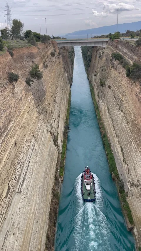Vertical Aerial View of Boat Navigating Corinth Canal Greece - Dramatic Stock Footage 334715572